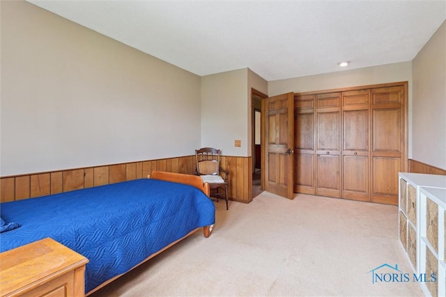 2142 Tracy Rd, Northwood, OH 43619 - bedroom with a wainscoted wall, light carpet, and wooden walls