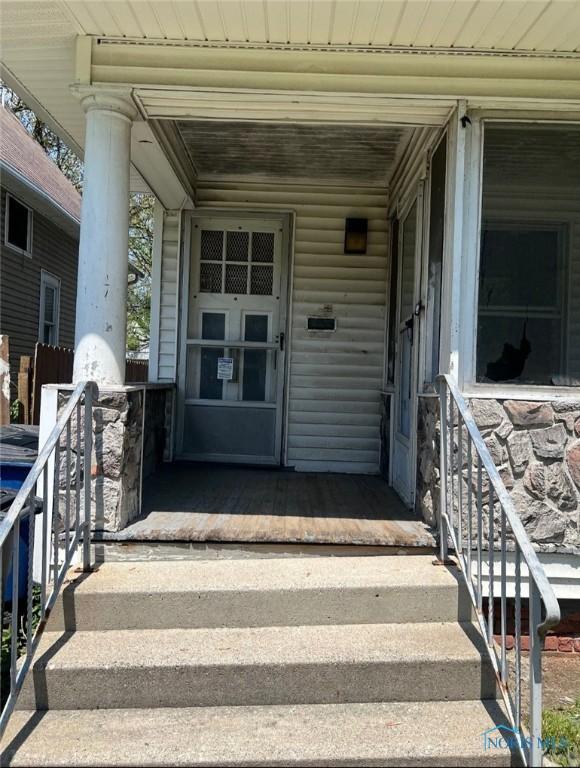 636 Nesslewood Ave, Toledo, OH 43610 - doorway to property featuring covered porch