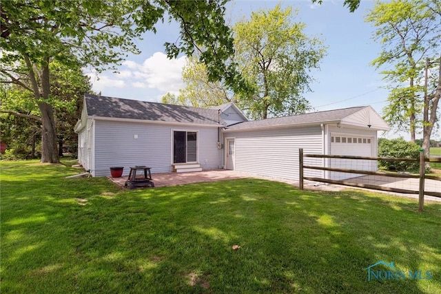 10540 Veler Rd, Curtice, OH 43412 - rear view of property with an attached garage and a patio area