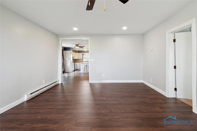 10540 Veler Rd, Curtice, OH 43412 - empty room with ceiling fan, a baseboard radiator, wood finished floors, recessed lighting, and baseboards