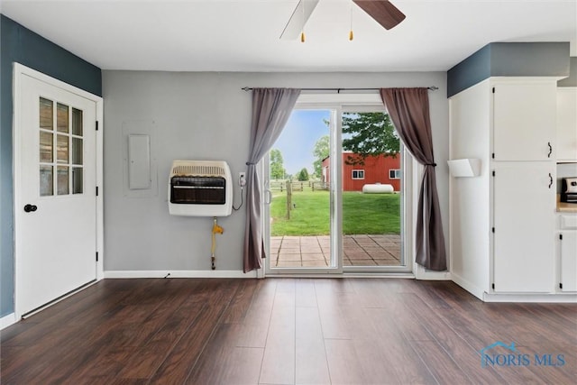 10540 Veler Rd, Curtice, OH 43412 - doorway featuring heating unit, dark wood-type flooring, a ceiling fan, and baseboards