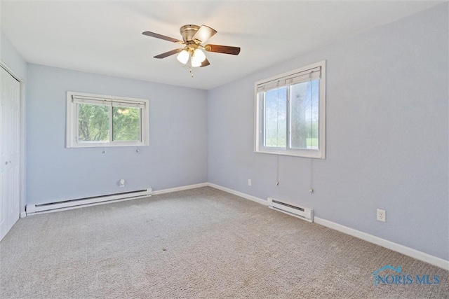10540 Veler Rd, Curtice, OH 43412 - unfurnished bedroom with a baseboard radiator, carpet floors, and a closet