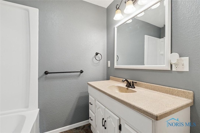 10540 Veler Rd, Curtice, OH 43412 - full bath featuring vanity, baseboards, a bath, and a textured wall