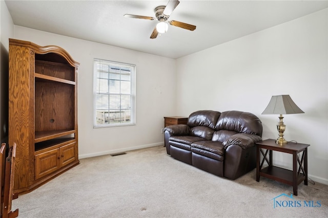 209 E Sawmill Rd, Findlay, OH 45840 - living room featuring light carpet, ceiling fan, and baseboards
