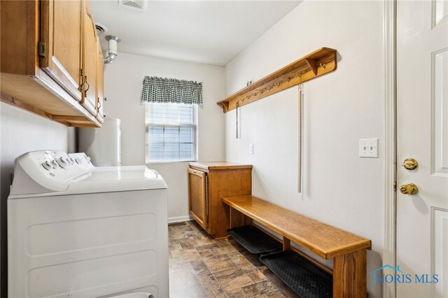 209 E Sawmill Rd, Findlay, OH 45840 - laundry room with water heater, independent washer and dryer, cabinet space, stone finish flooring, and baseboards