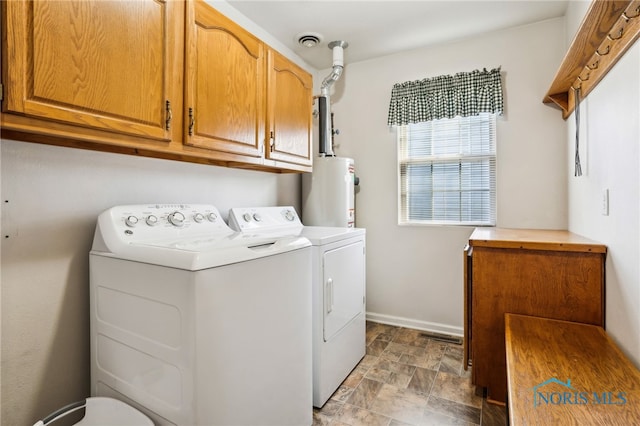 209 E Sawmill Rd, Findlay, OH 45840 - washroom with water heater, separate washer and dryer, stone finish flooring, cabinet space, and baseboards