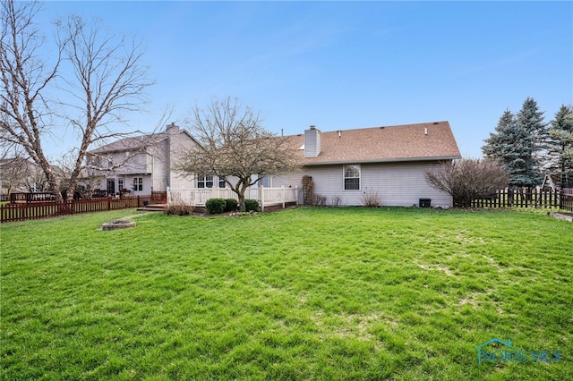 209 E Sawmill Rd, Findlay, OH 45840 - back of house with a chimney, a deck, and an outdoor fire pit