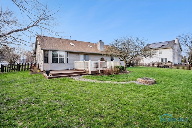 209 E Sawmill Rd, Findlay, OH 45840 - rear view of house featuring an outdoor fire pit, a wooden deck, and a chimney