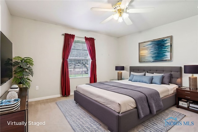 209 E Sawmill Rd, Findlay, OH 45840 - bedroom with light carpet, baseboards, and ceiling fan