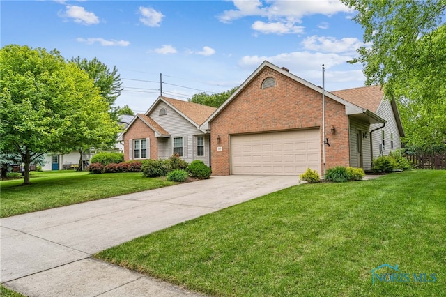 209 E Sawmill Rd, Findlay, OH 45840 - single story home featuring brick siding, a garage, a front lawn, and driveway