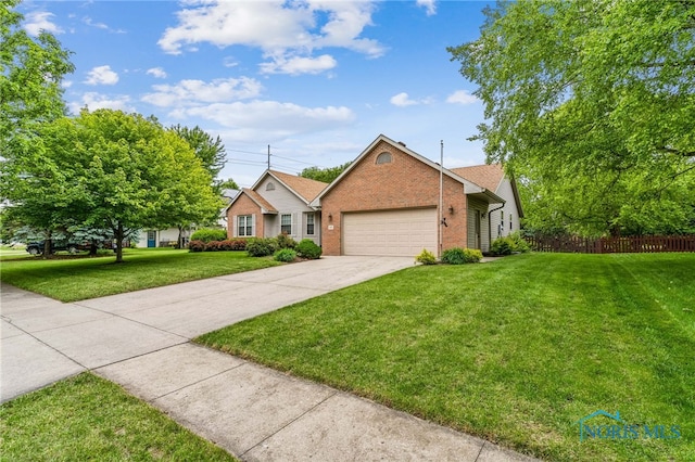 209 E Sawmill Rd, Findlay, OH 45840 - single story home featuring brick siding, an attached garage, and concrete driveway