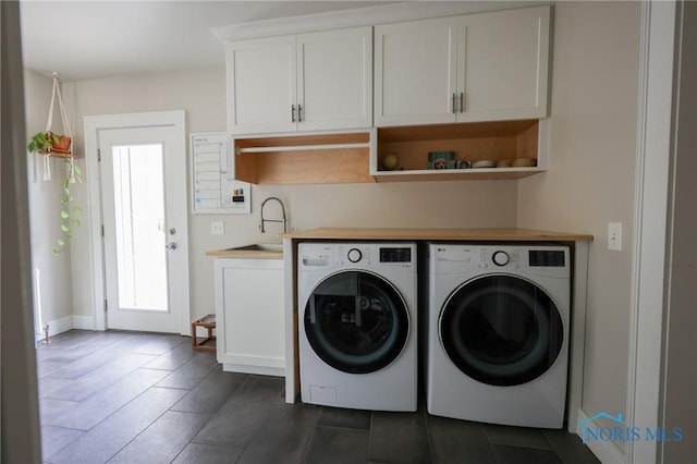 5243 Flanders Rd, Toledo, OH 43623 - laundry area with separate washer and dryer and cabinet space