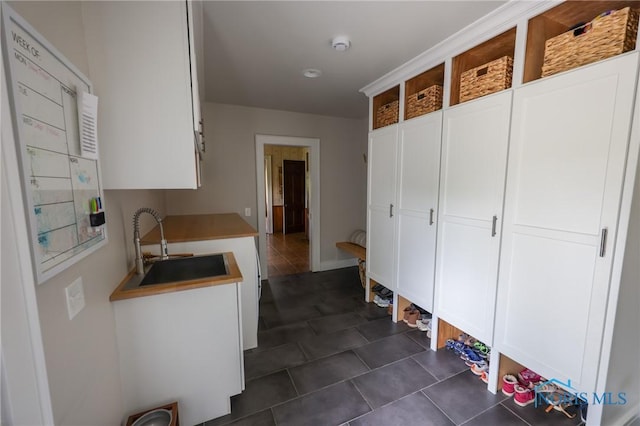 5243 Flanders Rd, Toledo, OH 43623 - mudroom with a sink and dark tile patterned flooring