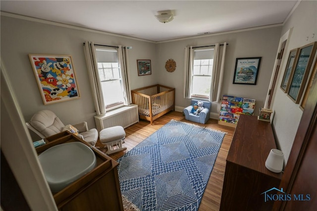 5243 Flanders Rd, Toledo, OH 43623 - living area featuring wood finished floors, ornamental molding, and baseboards