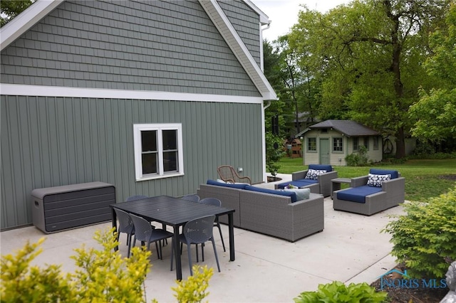 5243 Flanders Rd, Toledo, OH 43623 - view of patio with an outdoor hangout area, an outbuilding, and outdoor dining area