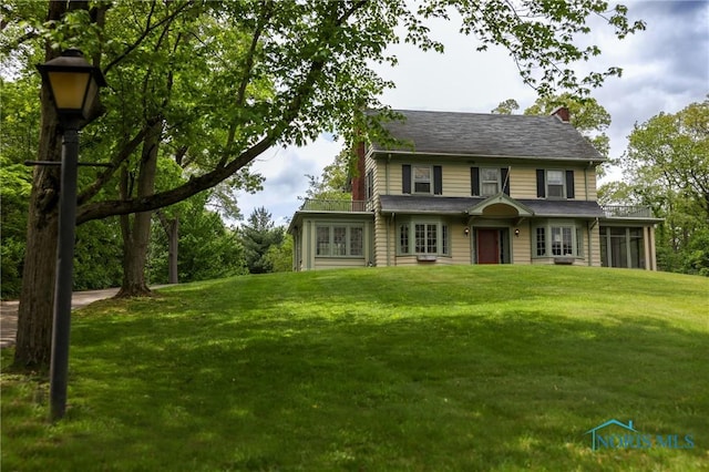 5243 Flanders Rd, Toledo, OH 43623 - view of front facade with a front yard and a chimney