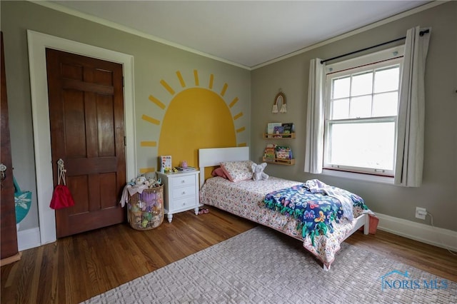 5243 Flanders Rd, Toledo, OH 43623 - bedroom featuring wood finished floors, ornamental molding, and baseboards