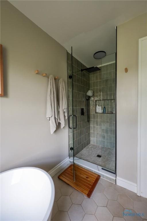 5243 Flanders Rd, Toledo, OH 43623 - full bath featuring tile patterned floors, a shower stall, and baseboards