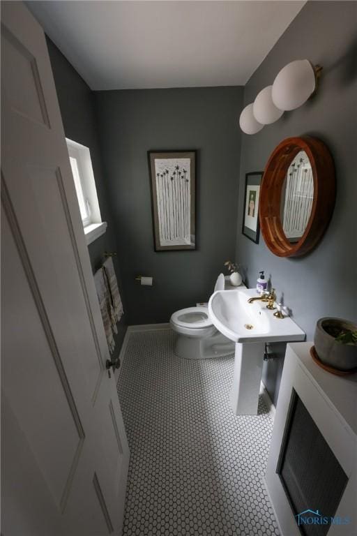 5243 Flanders Rd, Toledo, OH 43623 - half bathroom with toilet and baseboards