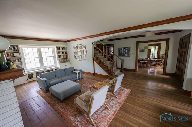 5243 Flanders Rd, Toledo, OH 43623 - living area featuring stairs, baseboards, crown molding, radiator, and wood finished floors
