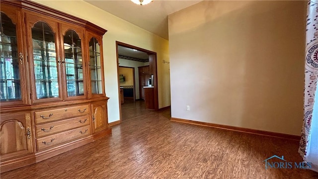 12327 Buckeye Dr, Paulding, OH 45879 - empty room featuring wood finished floors and baseboards