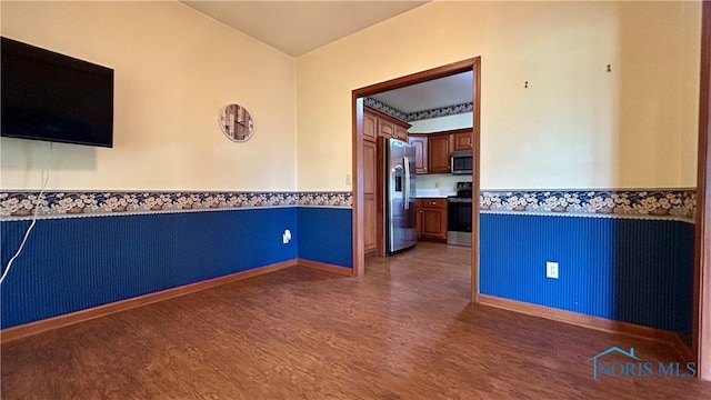 12327 Buckeye Dr, Paulding, OH 45879 - empty room featuring wainscoting and wood finished floors