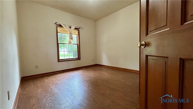 12327 Buckeye Dr, Paulding, OH 45879 - unfurnished room featuring wood finished floors and baseboards