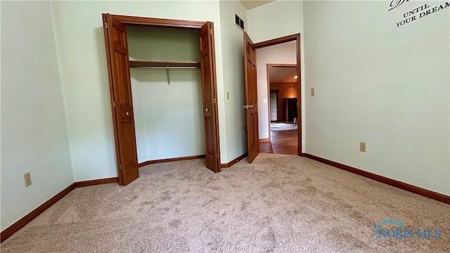 12327 Buckeye Dr, Paulding, OH 45879 - unfurnished bedroom with light colored carpet and a closet