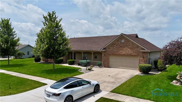 12327 Buckeye Dr, Paulding, OH 45879 - single story home featuring brick siding, an attached garage, a front lawn, driveway, and covered porch