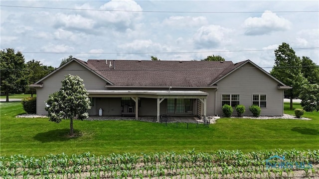 12327 Buckeye Dr, Paulding, OH 45879 - back of property with a yard and a shingled roof