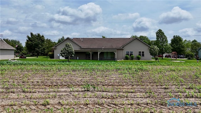 12327 Buckeye Dr, Paulding, OH 45879 - rear view of property featuring a lawn