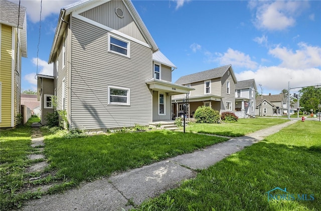 446 Center St, Findlay, OH 45840 - view of property exterior with a residential view and a yard