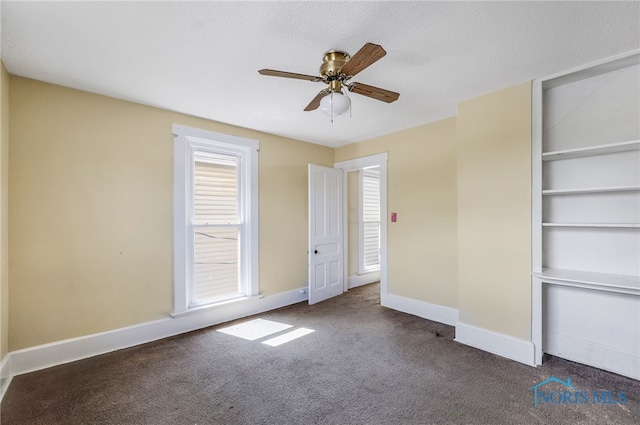 446 Center St, Findlay, OH 45840 - unfurnished bedroom featuring carpet, baseboards, ceiling fan, and a textured ceiling