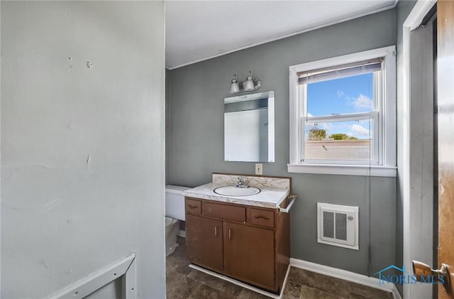 446 Center St, Findlay, OH 45840 - half bathroom with vanity, baseboards, and toilet