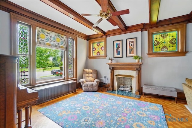 1100 S Main St, Findlay, OH 45840 - sitting room featuring radiator heating unit, a premium fireplace, ceiling fan, and beam ceiling