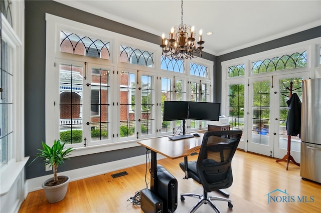 1100 S Main St, Findlay, OH 45840 - home office featuring french doors, plenty of natural light, a chandelier, ornamental molding, and wood finished floors