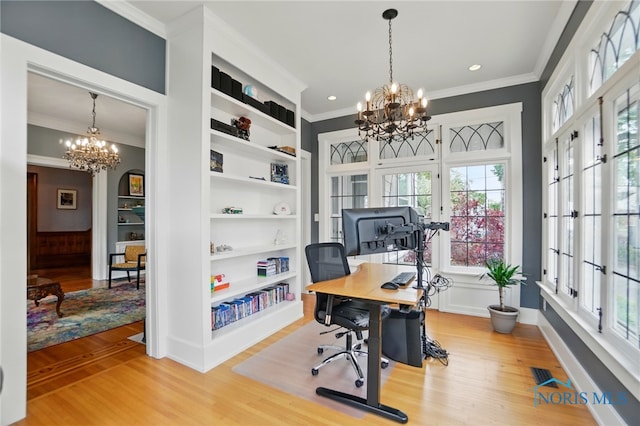 1100 S Main St, Findlay, OH 45840 - office space featuring a chandelier, crown molding, wood finished floors, built in features, and baseboards
