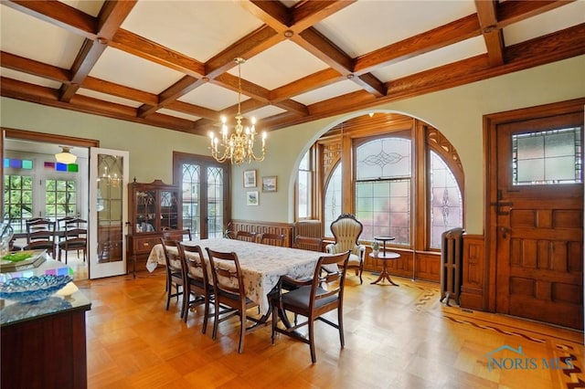 1100 S Main St, Findlay, OH 45840 - dining room featuring wainscoting, beamed ceiling, coffered ceiling, a chandelier, and arched walkways