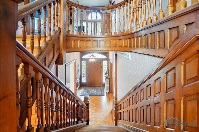 1100 S Main St, Findlay, OH 45840 - foyer entrance with a high ceiling, a chandelier, and a textured wall