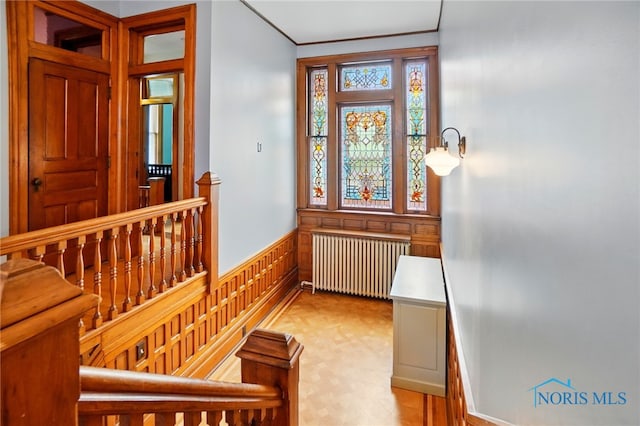 1100 S Main St, Findlay, OH 45840 - foyer entrance featuring radiator, crown molding, and wainscoting