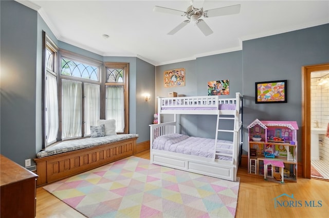 1100 S Main St, Findlay, OH 45840 - bedroom with wood finished floors, ornamental molding, and ceiling fan