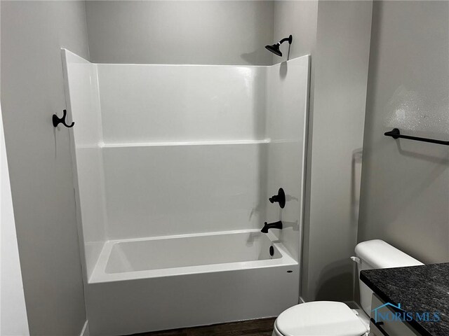 4015 E Plaza Blvd, Northwood, OH 43619 - full bathroom with toilet, bathtub / shower combination, vanity, and wood finished floors