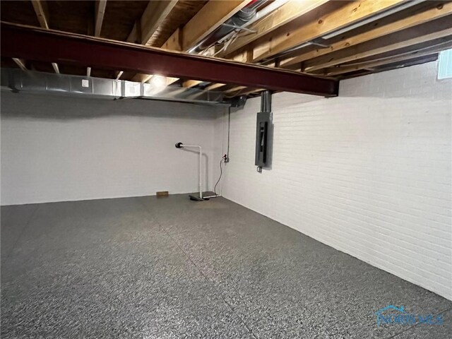 4015 E Plaza Blvd, Northwood, OH 43619 - unfinished below grade area with electric panel and brick wall