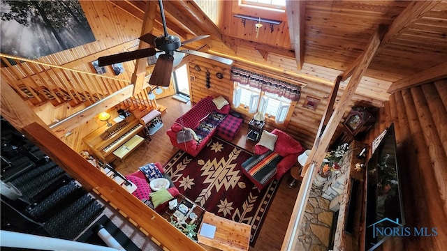 17884 Euler Rd, Bowling Green, OH 43402 - living room featuring wood finished floors, a ceiling fan, wood ceiling with exposed beams, and high vaulted ceiling