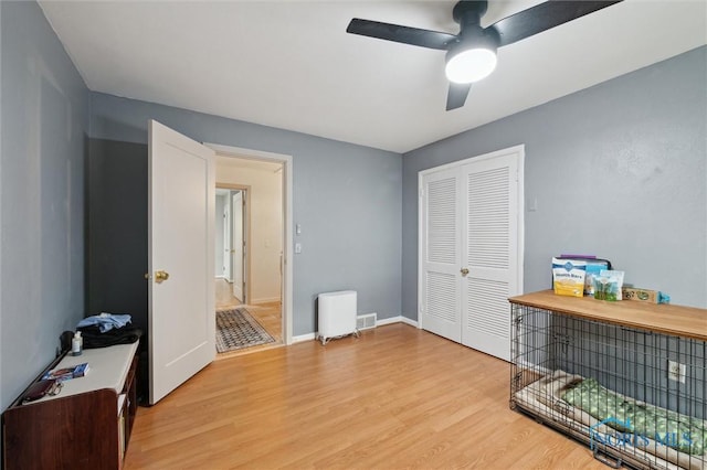 2222 Talmadge Rd, Ottawa Hills, OH 43606 - bedroom with light wood-style floors, a closet, ceiling fan, and baseboards