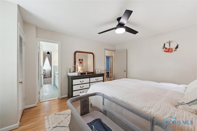 2222 Talmadge Rd, Ottawa Hills, OH 43606 - bedroom featuring light wood-style floors, baseboards, a closet, a ceiling fan, and ensuite bathroom