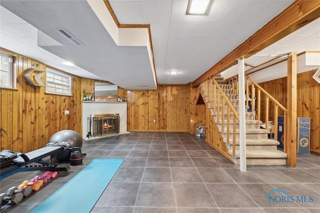 2222 Talmadge Rd, Ottawa Hills, OH 43606 - below grade area featuring wood walls, a fireplace, stairway, and tile patterned flooring
