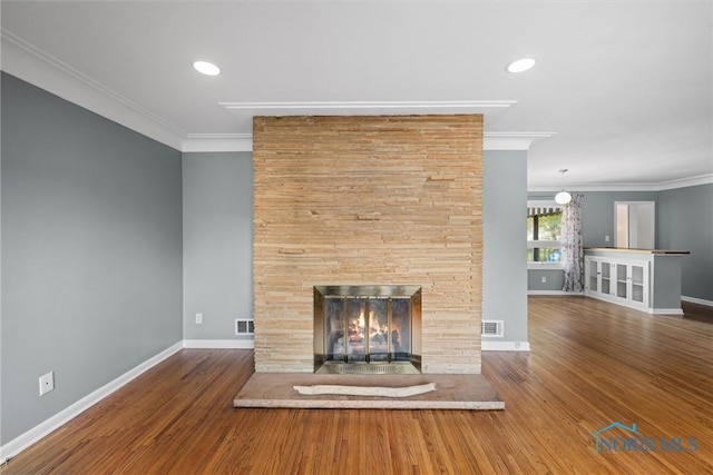 4550 W Sylvania Ave, Toledo, OH 43623 - unfurnished living room with crown molding, a fireplace, baseboards, and wood finished floors
