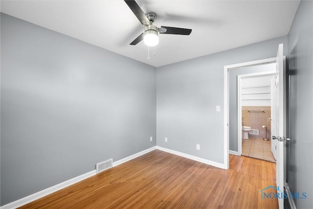 4550 W Sylvania Ave, Toledo, OH 43623 - unfurnished room featuring ceiling fan, light wood finished floors, and baseboards