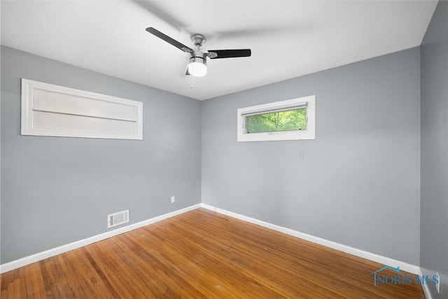 4550 W Sylvania Ave, Toledo, OH 43623 - spare room featuring baseboards, ceiling fan, and wood finished floors